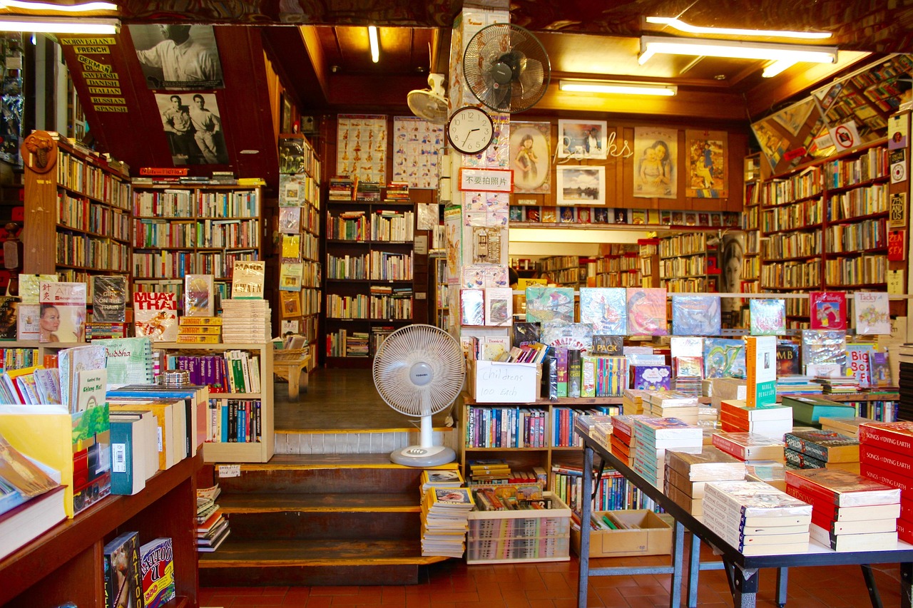 a second-hand bookshop crammed with shelves and stacks of old books